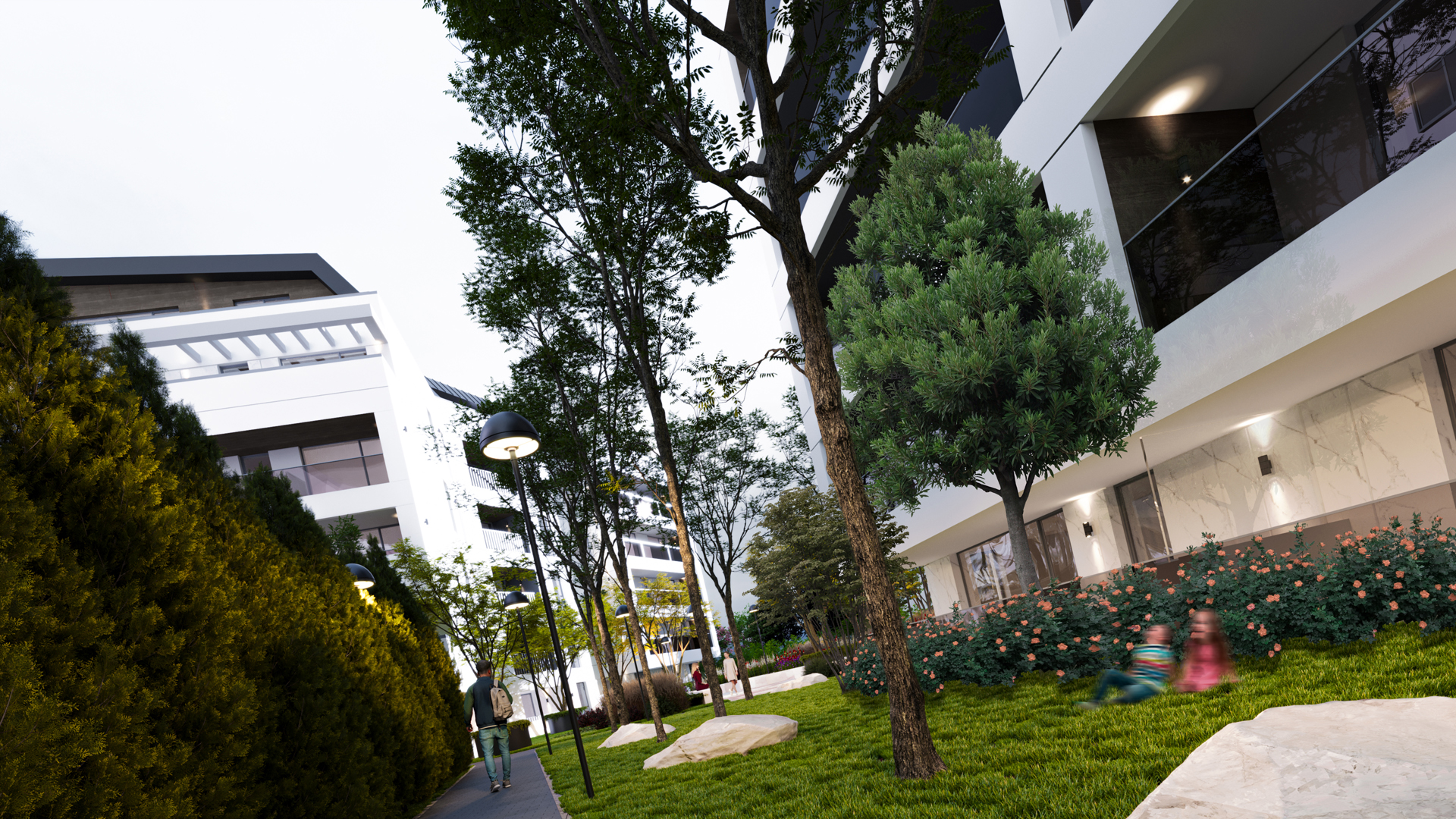 Grădină amenajată între cele două blocuri de locuințe la Cosmopolit Cantacuzino cu vegetație și alei